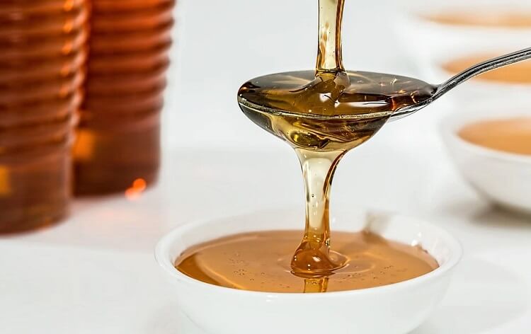 صورة عسل وتوضيح فوائد البيض والعسل للشعر
